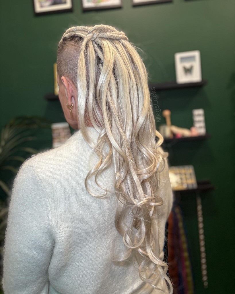 Wrapped locs with sun charm